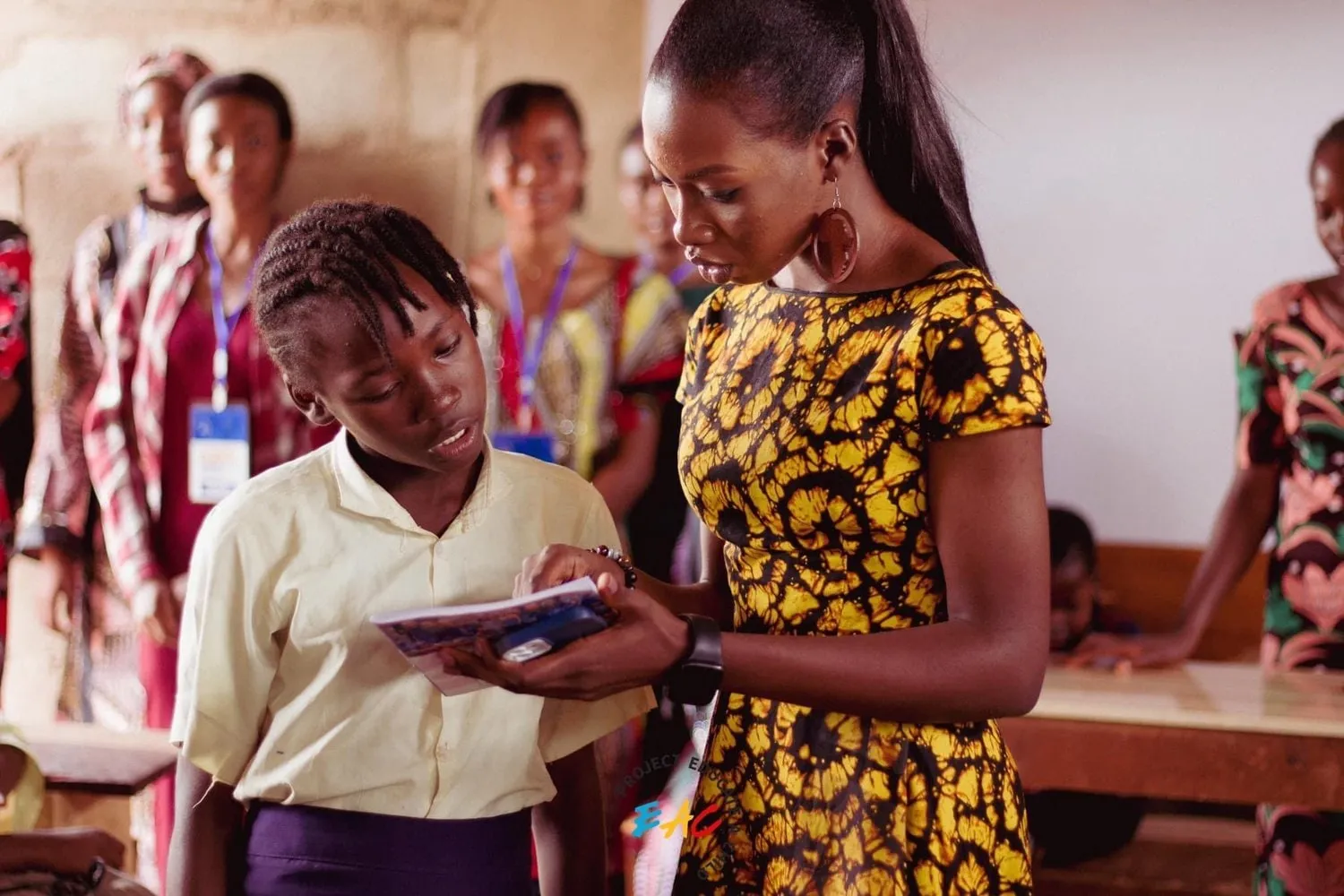 Seyi+and+a+girl+at+EAC+Outreach
